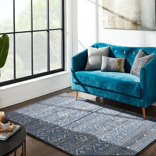 blue sofa & a beautiful carpet